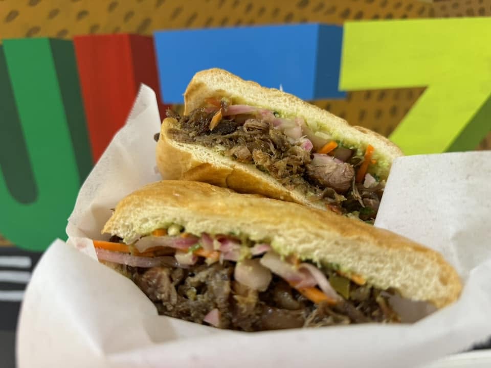 Freshly made torta with slow-cooked meat and pickled vegetables